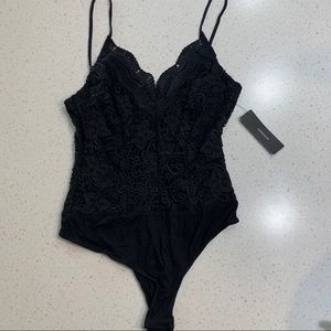 Lulu’s black lace bodysuit cami